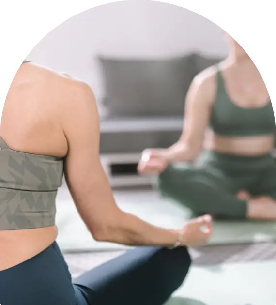 Woman practicing yoga in a calm indoor space.